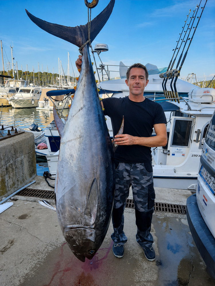 Skipper Alexander Schmid at the helm
